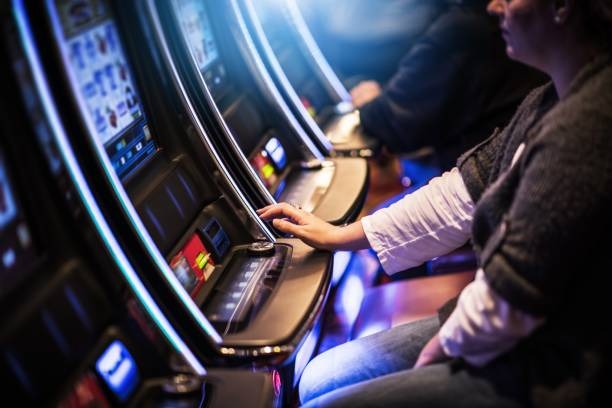 Live dealer at Dream Gaming blackjack table with cards and chips visible